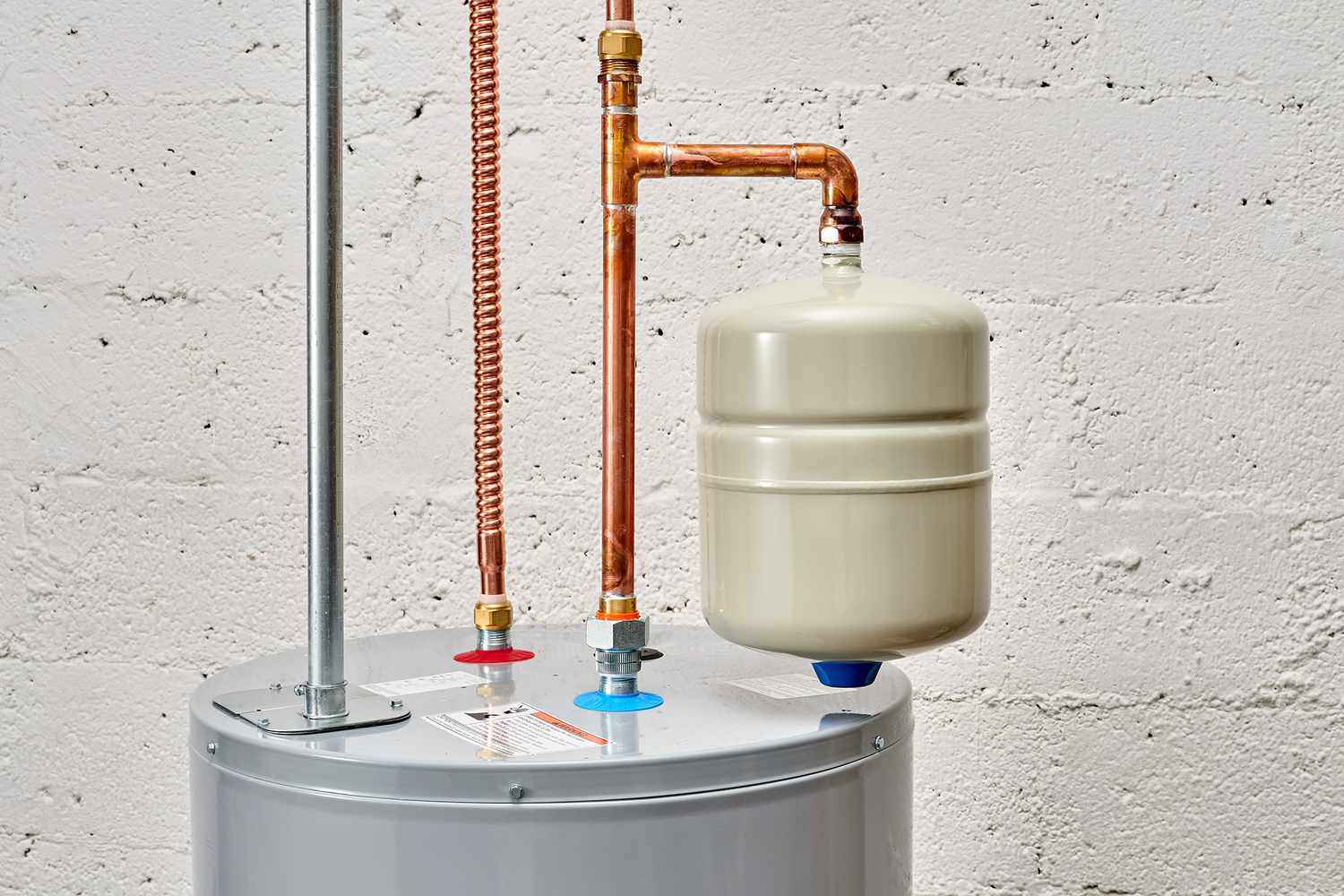 Under-sink reverse osmosis unit being serviced by a plumber