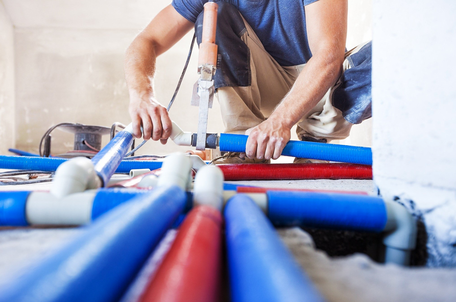 Plumber removing old galvanized pipes during a repipe in Oceanside, CA