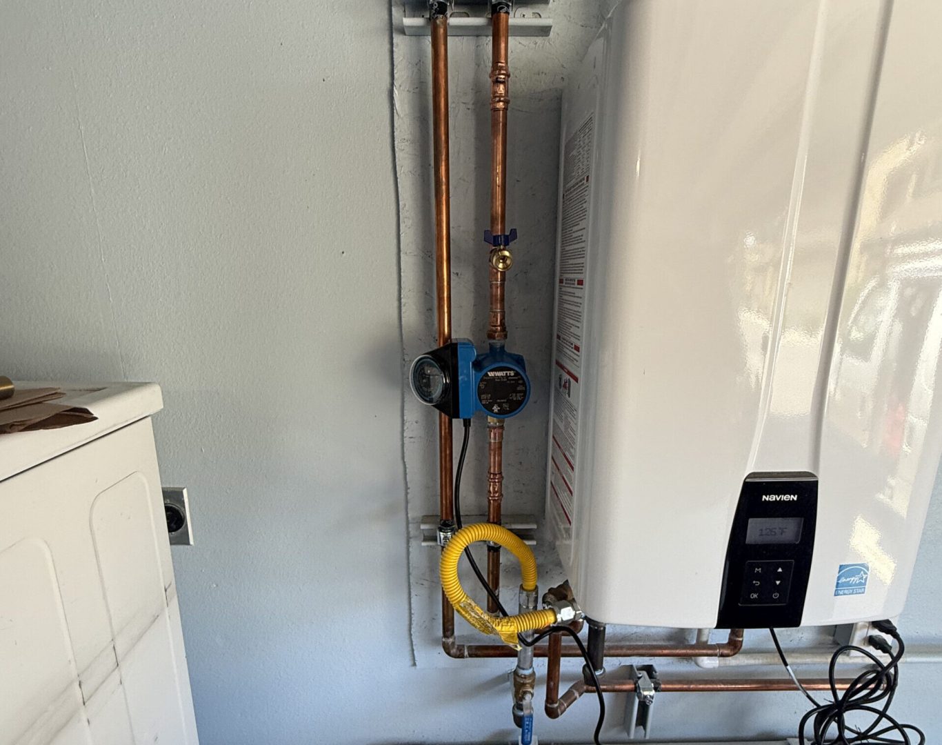 Plumber removing old galvanized pipes during a repipe in Oceanside, CA