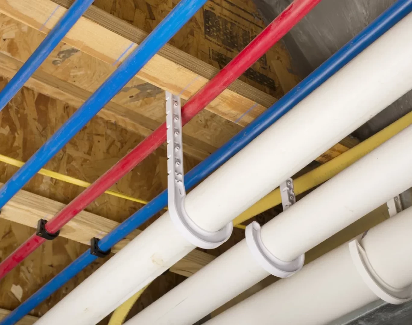 Plumber removing old galvanized pipes during a repipe in Oceanside, CA